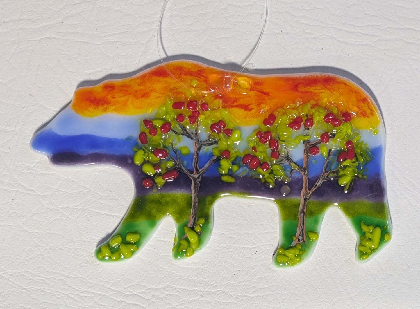 mountain bear with apple trees